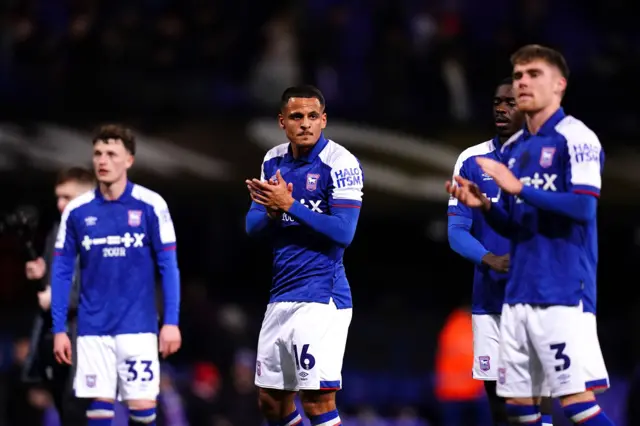 Ipswich players applaud the fans after beating Rotherham