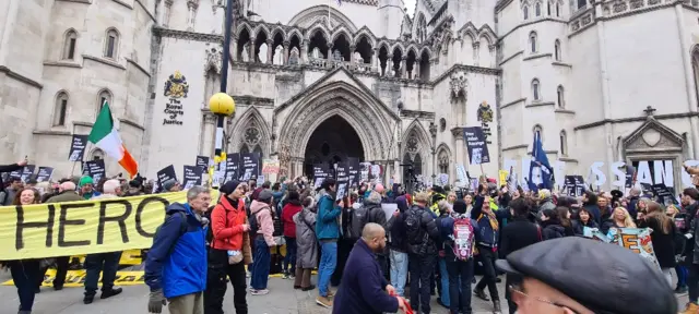 A crowd of protesters outside the High Court