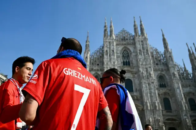 Atletico fans sightsee at the Duomo Cathedral in Milan.