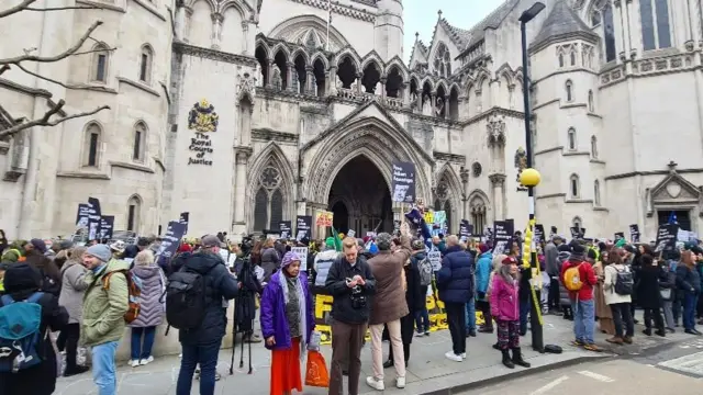 Media and supporters of Julian Assange gather outside High Court