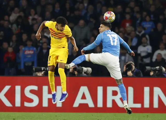 Lamine Yamal heads at goal for Barcelona.