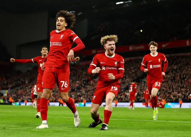 Liverpool's Harvey Elliott celebrates scoring their fourth goal with Jayden Danns