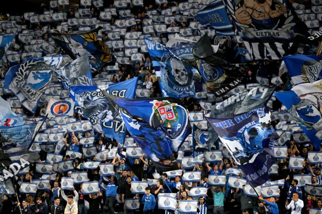 Porto fans hold up scarves before the game.