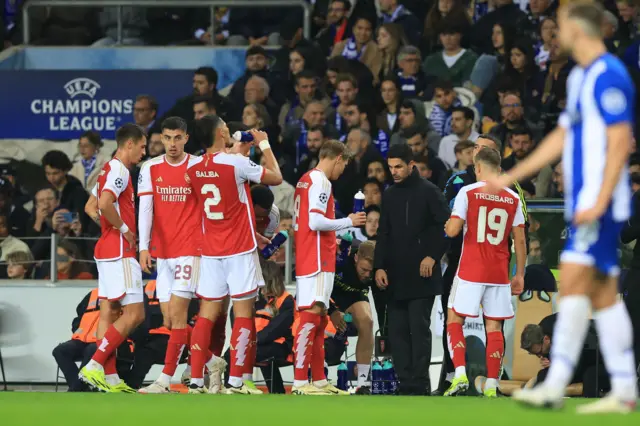 Arteta addresses some of his players as they take a drinks break.