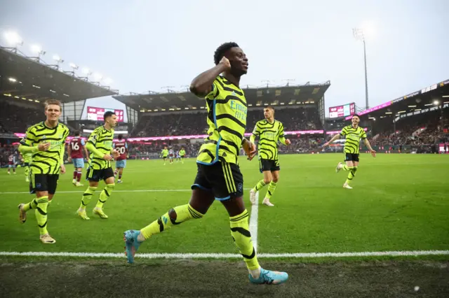 Saka cups his ear in celebration of his goal at Turf Moor.