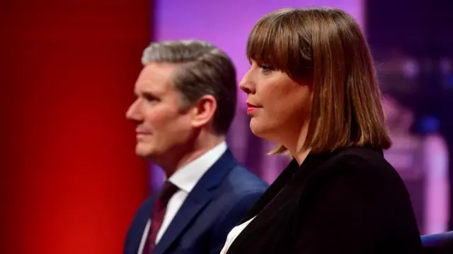 Jess Phillips sits next to Keir Starmer on a TV set