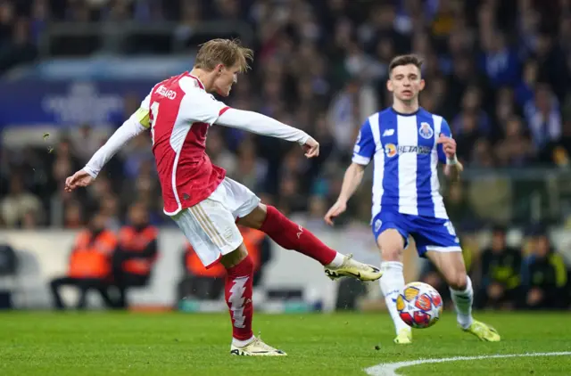 Odegaard shoots at goal from the edge of the box.