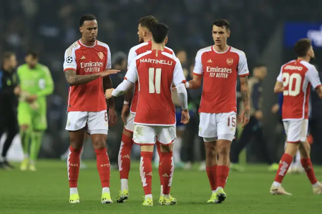 Arsenal players commiserate at full time after defeat.