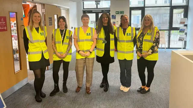 Staff helping at Beacon Centre