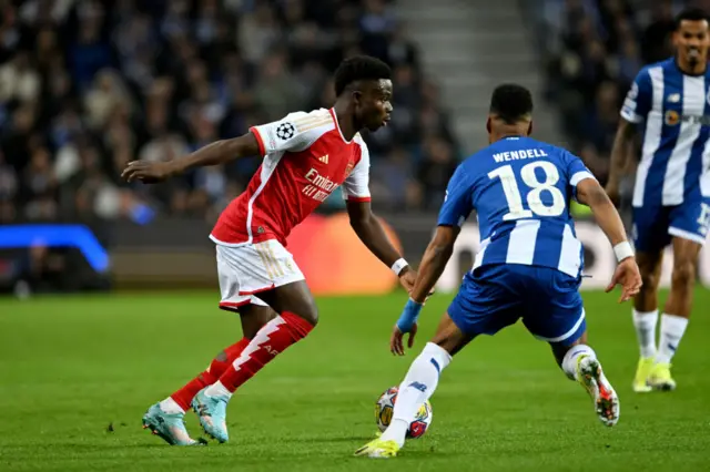 Saka cuts inside from the wing to play the ball to a teammate.