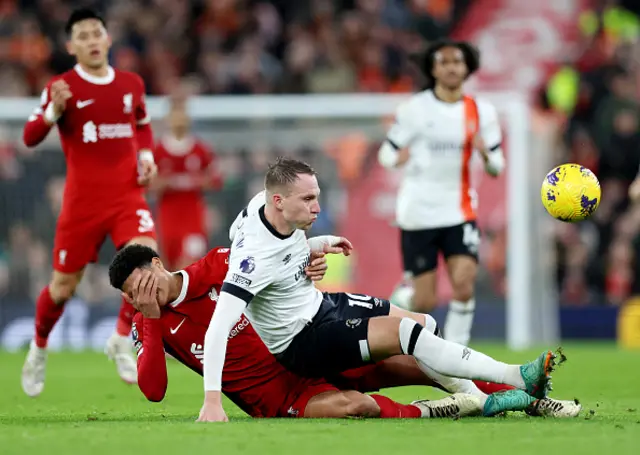 Cauley Woodrow of Luton Town is challenged by Jarell Quansah