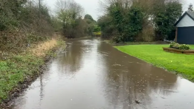 Flood water on St Peter's Lane in Bickenhill