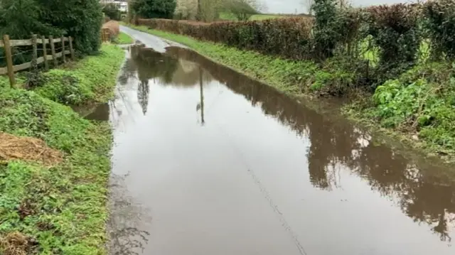 A flooded road in Hadley, Worcestershire