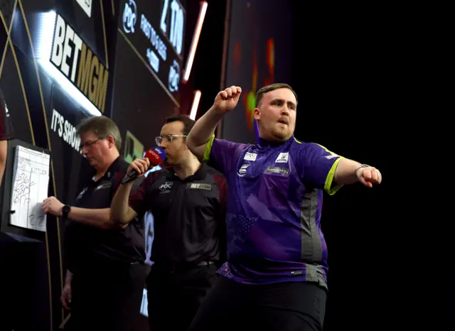 Luke Littler celebrates taking out 170 against Peter Wright