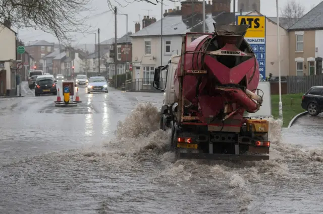 Vehicles in flood water in Stafford