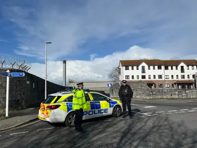 Police officers on one of the closed roads in Plymouth