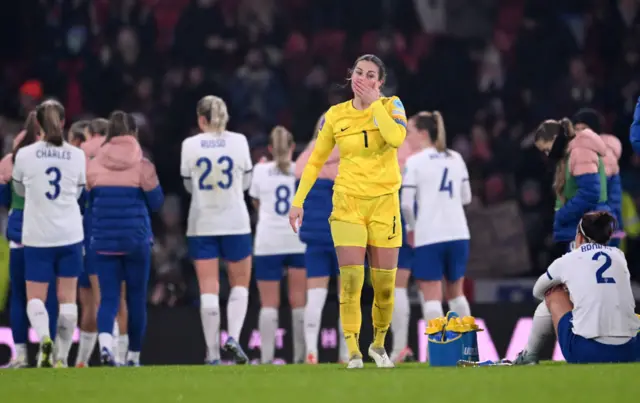 The England players react to missing out on Olympic qualifying.