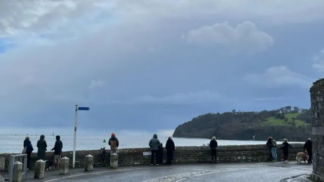 People gathered at Devil's Point in Plymouth