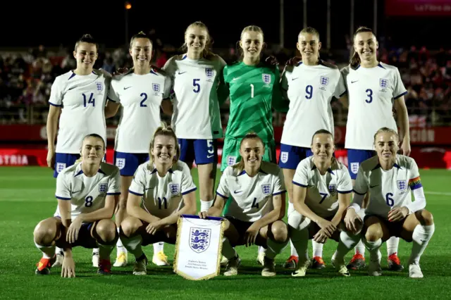 England players line up for their official photo before the game.