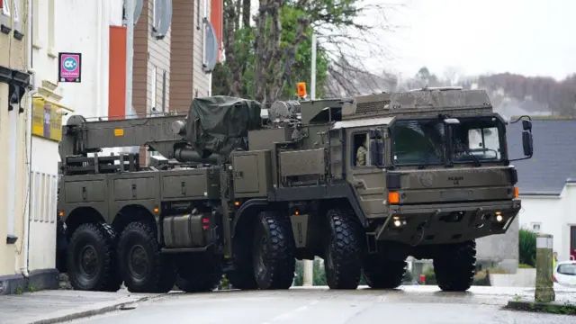 A military vehicle at the scene near St Michael Avenue, Plymouth, number plate blurred