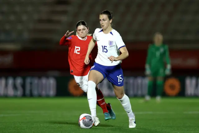 Wubben-Moy dribbles out of defence with Billa in pursuit.