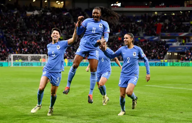 Diani celebrates scoring for France.