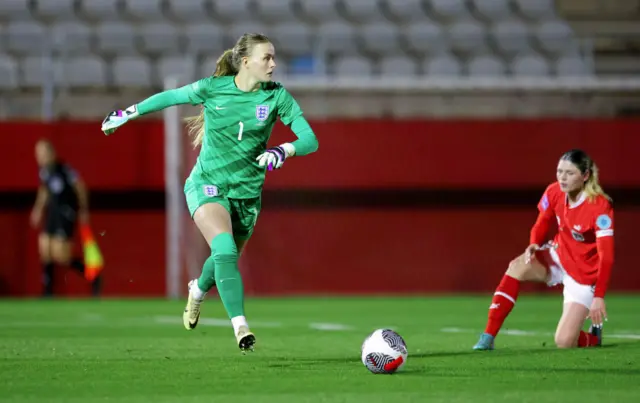 Hampton clears the ball away from an Austria attacker.