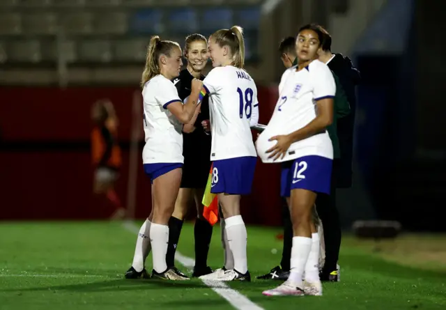 Stanway hands over the armband to Walsh as she is replaced.