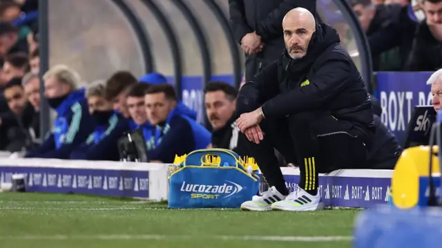 Enzo Maresca sits on the touchline