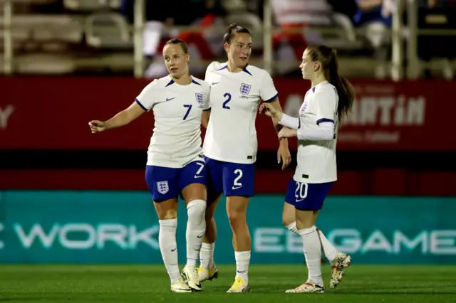 Mead is congratulated on her second goal of the game.