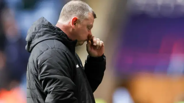 Mark Robins looks dejected