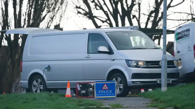 Emergency personnel at the scene near St Michael Avenue, Plymouth, drone car