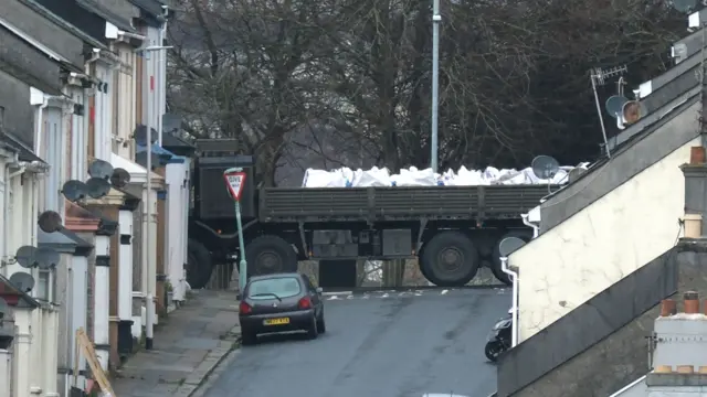 Bomb disposal experts remove a ordnance on the back of a vehicle near to the scene at St Michael Avenue, Plymouth, where residents have been evacuated and a cordon put in place following the discovery of the suspected Second World War explosive device.