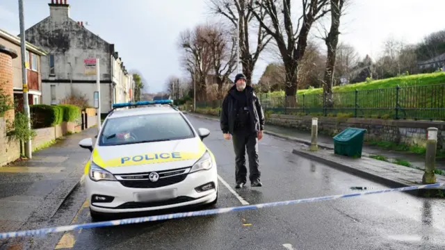 A police cordon at the scene near St Michael Avenue, Plymouth, number plate blurred