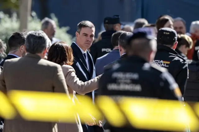 Spanish Prime Minister, Pedro Sanchez (C), arrives to visit the area where a fire destroyed two apartment buildings in Valencia, Spain, 23 February 2024