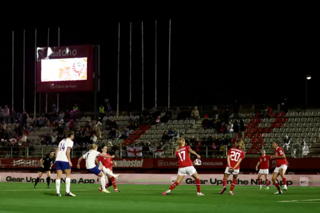 Mead curls the ball into the top corner through defenders.