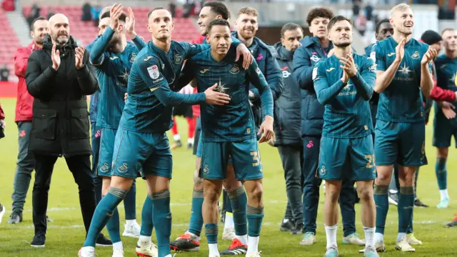 Swansea players celebrate victory