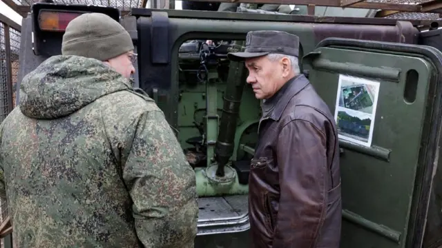 Russia's Defence Minister Sergei Shoigu inspects military equipment captured by Russian troops