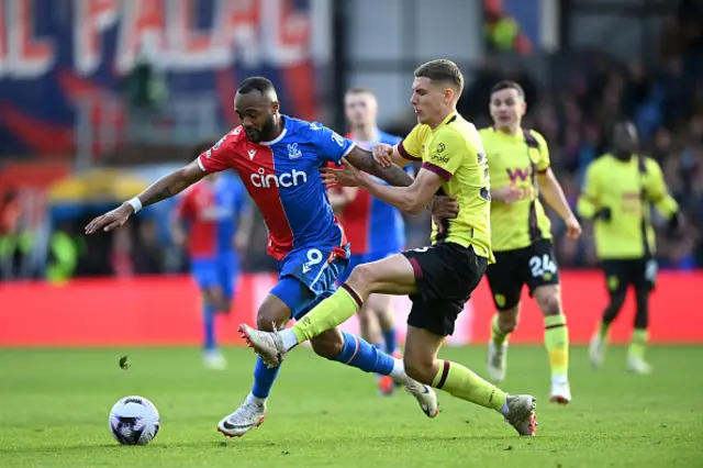 Jordan Ayew of Crystal Palace is challenged by Maxime Esteve