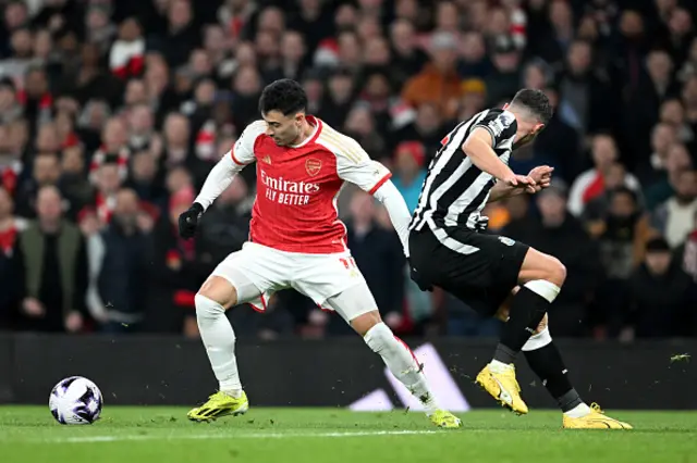 Gabriel Martinelli of Arsenal battles for possession with Tino Livramento