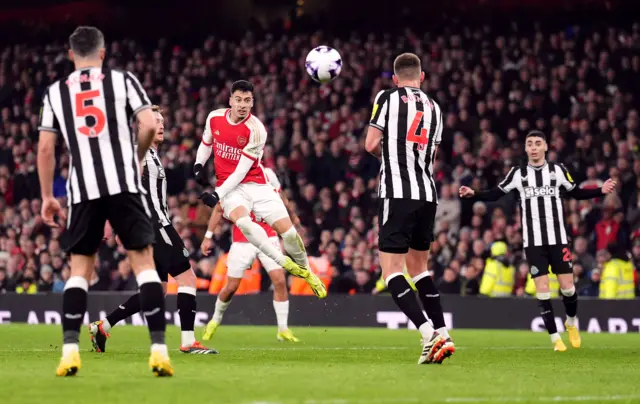 Gabriel Martinelli shoots during the Premier League match at the Emirates Stadium