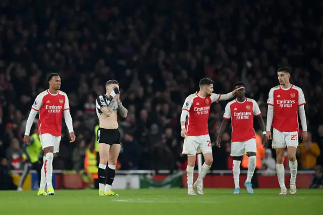 Kieran Trippier of Newcastle United (2L) looks dejected