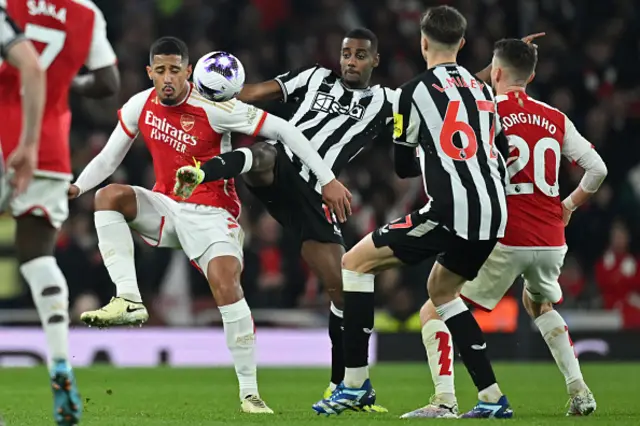 William Saliba (L) vies with Newcastle United's Swedish striker #14 Alexander Isak