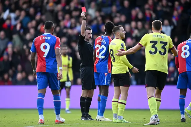 Referee, Lewis Smith shows a red card to Josh Brownhill