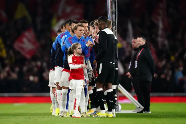 artin Odegaard and Newcastle United's Alexander Isak shake hand