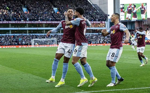 : Aston Villa's Douglas Luiz (centre) celebrates with teammates