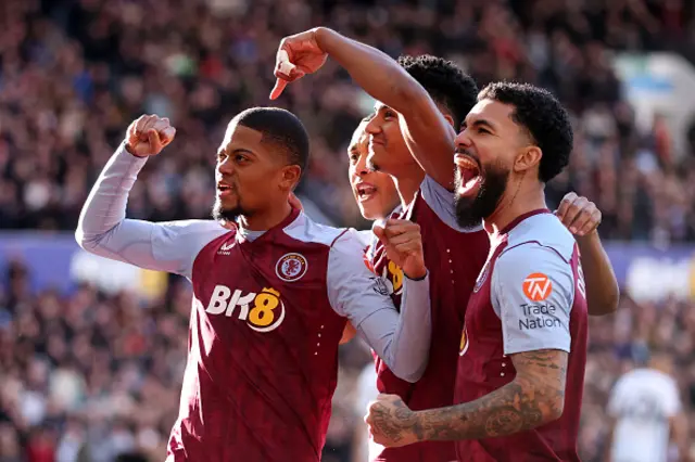 Leon Bailey  celebrates with teammates