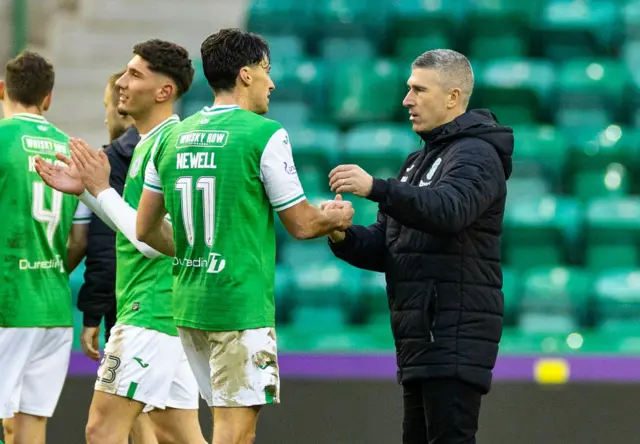 Hibernian players and manager Nick Montgomery celebrate