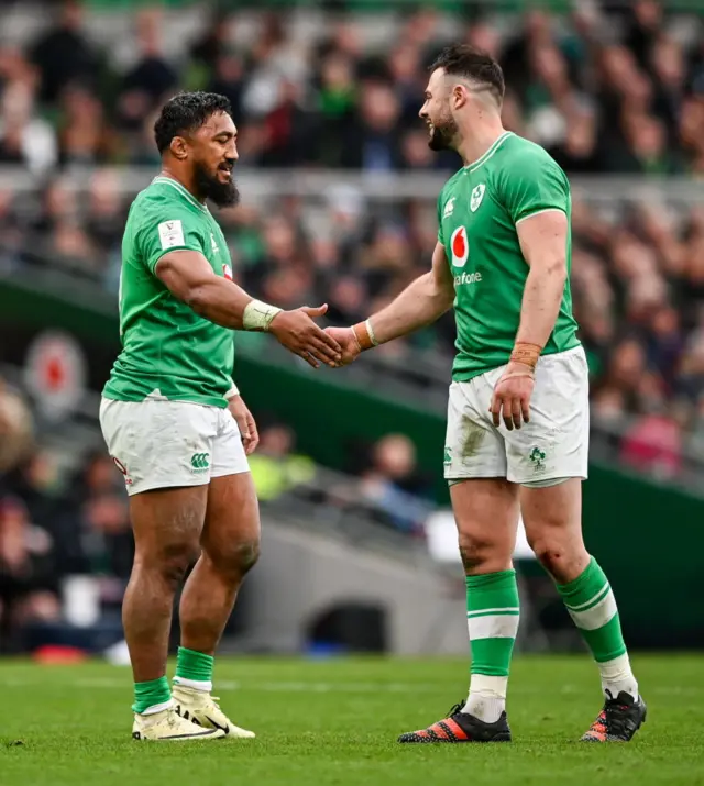 Two Irish players shaking hands