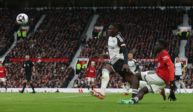 Omari Forson of Manchester United in action with Calvin Bassey